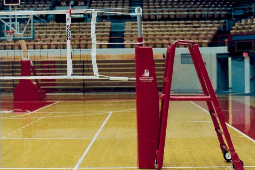 Historic Sports Imports volleyball net system installed in gym, showing decades of trusted court solutions