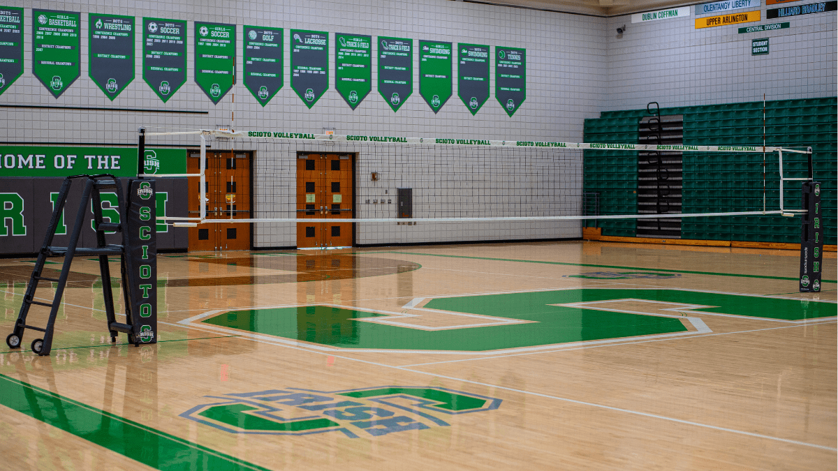 indoor volleyball net system installed with floorplates and sleeves
